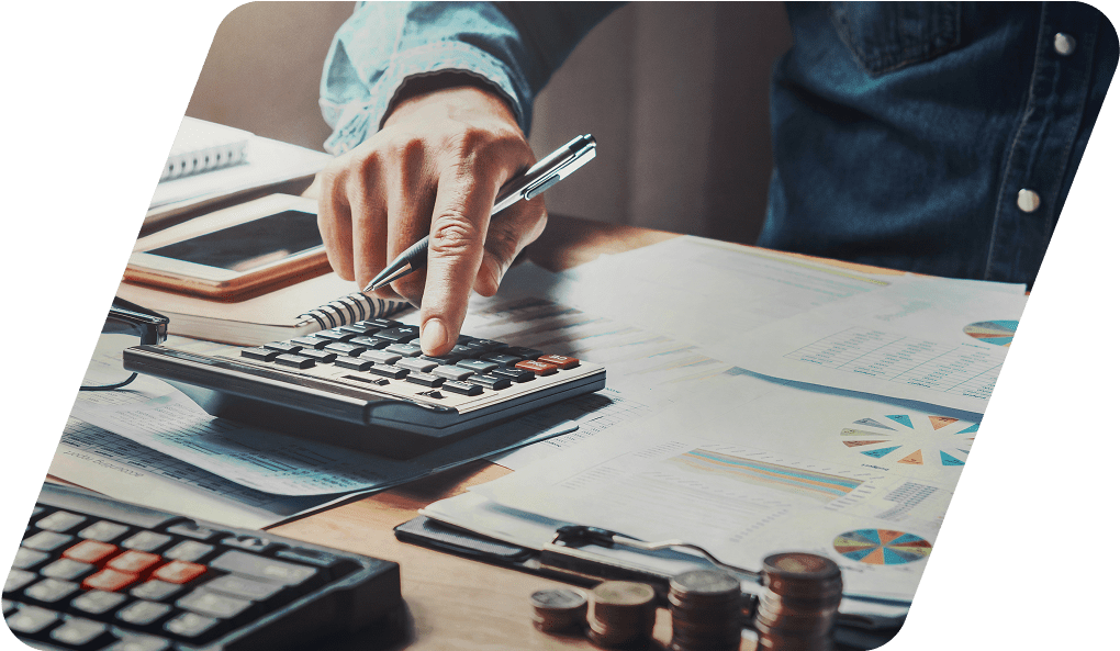Person using calculator at a desk.
